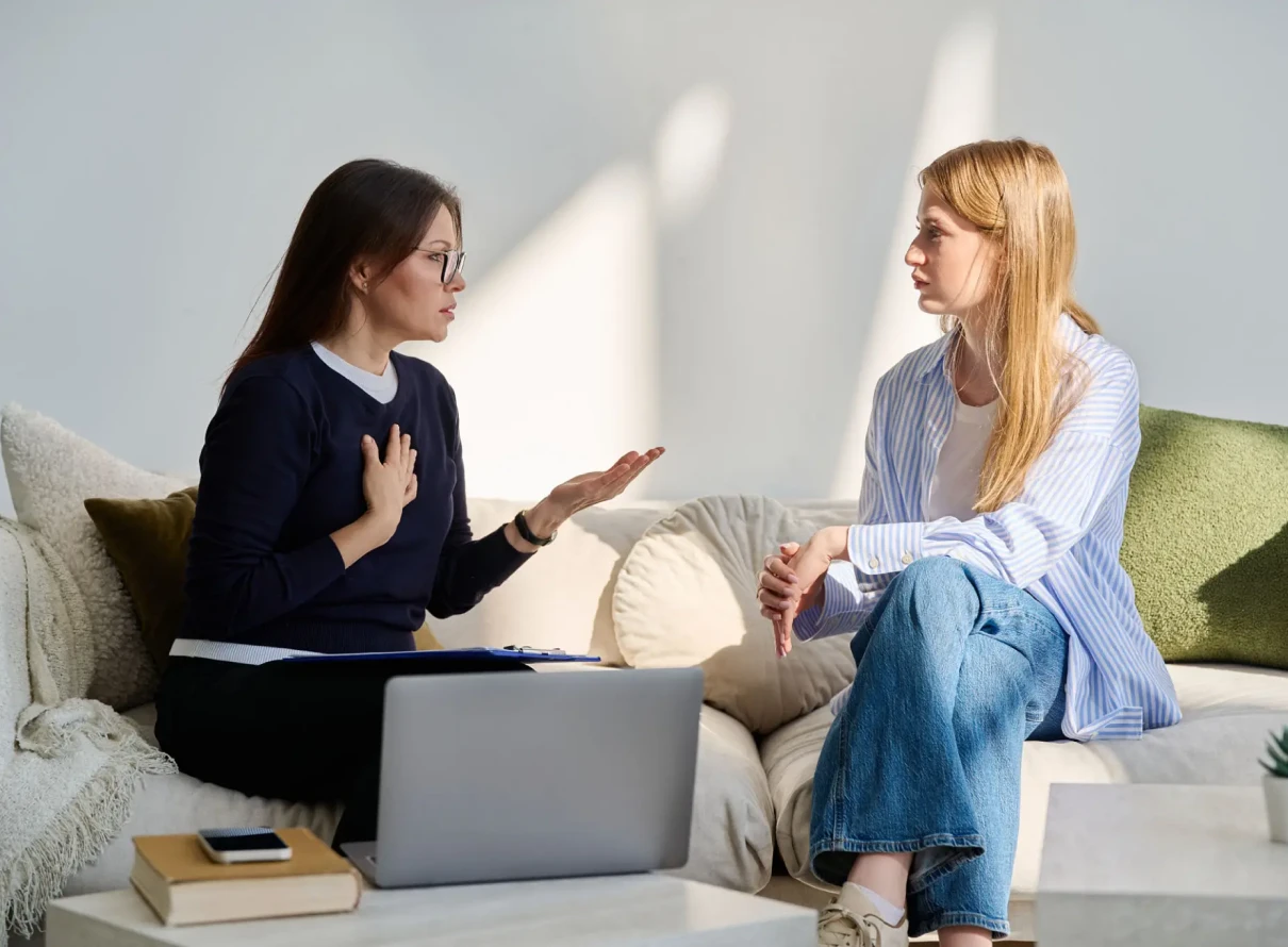 Two women having a serious conversation