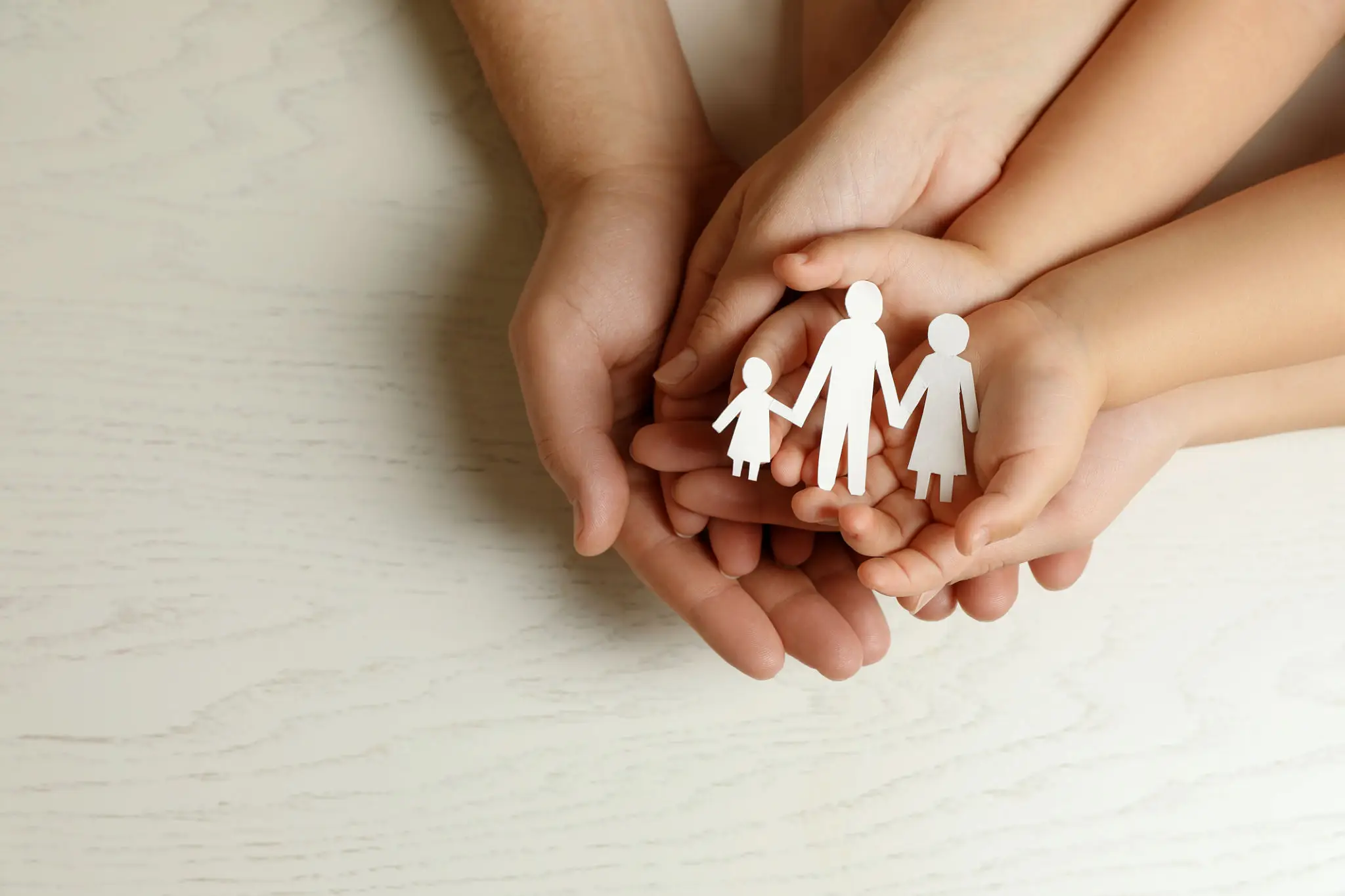Nurturing hands with family cutout