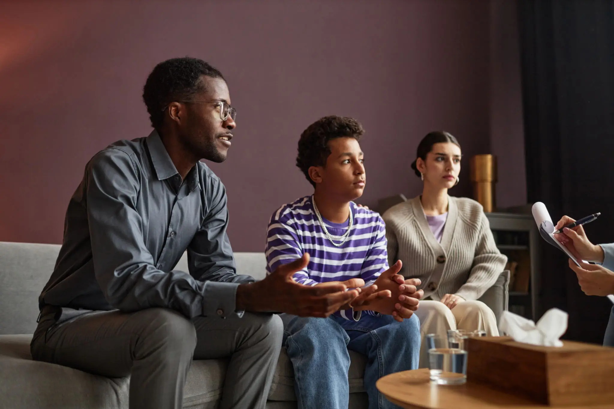 Family enjoying a video game together in the living room.
