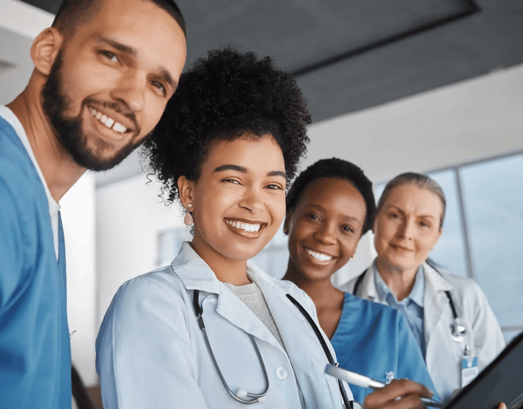 Group of diverse medical professionals smiling together.