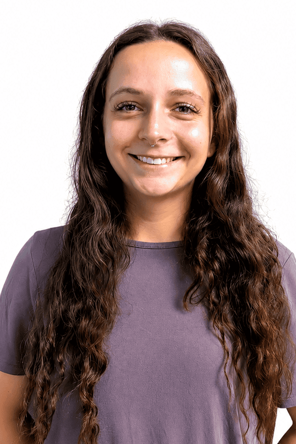 Smiling woman with a long, curly brown hair.