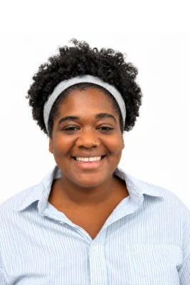 Cheerful woman wearing an gray headband.