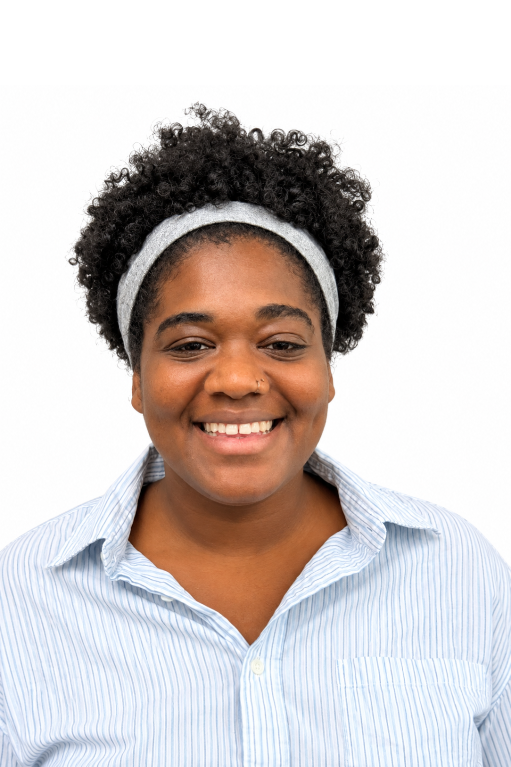 Cheerful woman wearing an gray headband.
